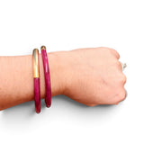 Fuchsia enamel cuff bracelet with textured brushed gold-tone finish.