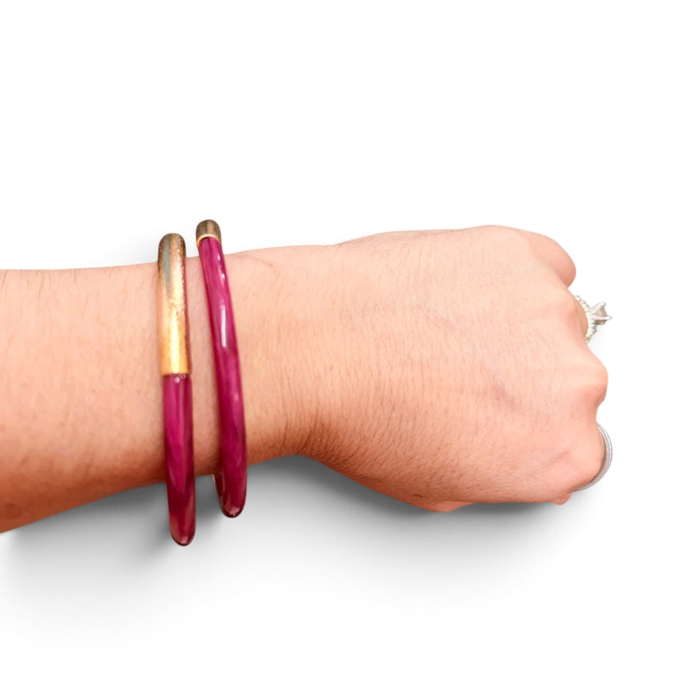 Fuchsia enamel cuff bracelet with textured brushed gold-tone finish.