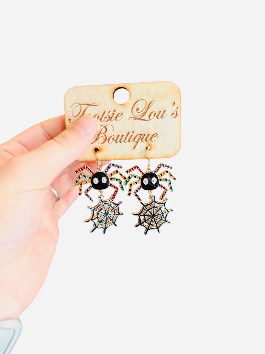 spider dangle earrings, metal colorful spider legs, web hanging down 