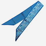 Royal blue polka dot and bandana reversible satin scarf tie styled as scarf or purse twilly.