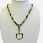 Chunky gold chain necklace with horse bit pendant