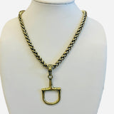 Chunky gold chain necklace with horse bit pendant