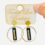 Gold hoops with black dangles and gold writing that says Bearcats set on gold glitter stud