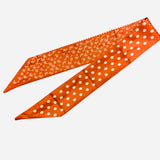 Burnt orange polka dot and bandana reversible satin scarf tie styled as scarf or purse twilly.