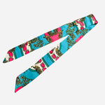 Turquoise print satin scarf tie styled as necklace, scarf, or purse twilly.