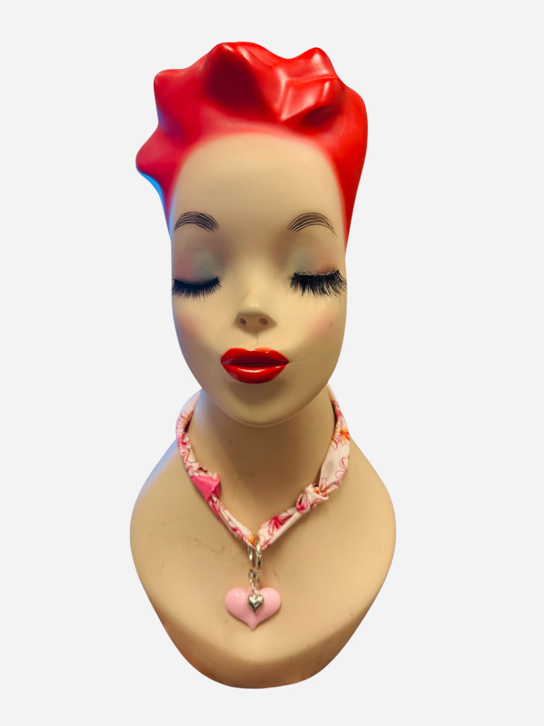 Pink and ivory floral scarf necklace with puffy pink heart charm and silver heart charm, tied in a stylish knot and designed to be worn as a necklace, bracelet, or accessory.