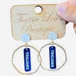 Gold hoops with blue dangles and white writing that says Trojans set on a white stud
