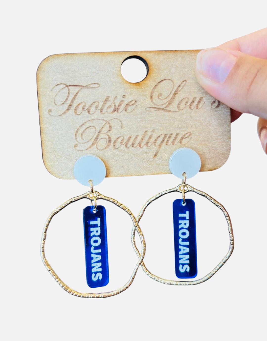 Gold hoops with blue dangles and white writing that says Trojans set on a white stud