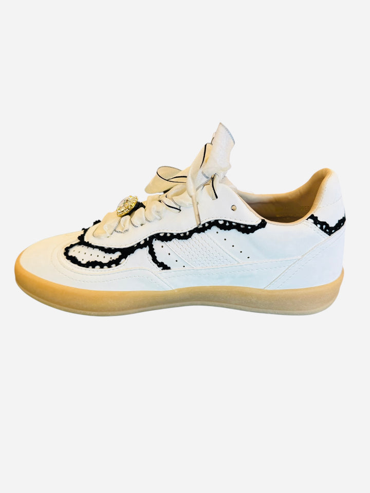 White low-top sneakers with vegan leather upper, delicate lace trim, lace-up closure, and round toe.