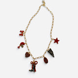 Red and black game day charm necklace with gold-tone chain and football-themed charms.