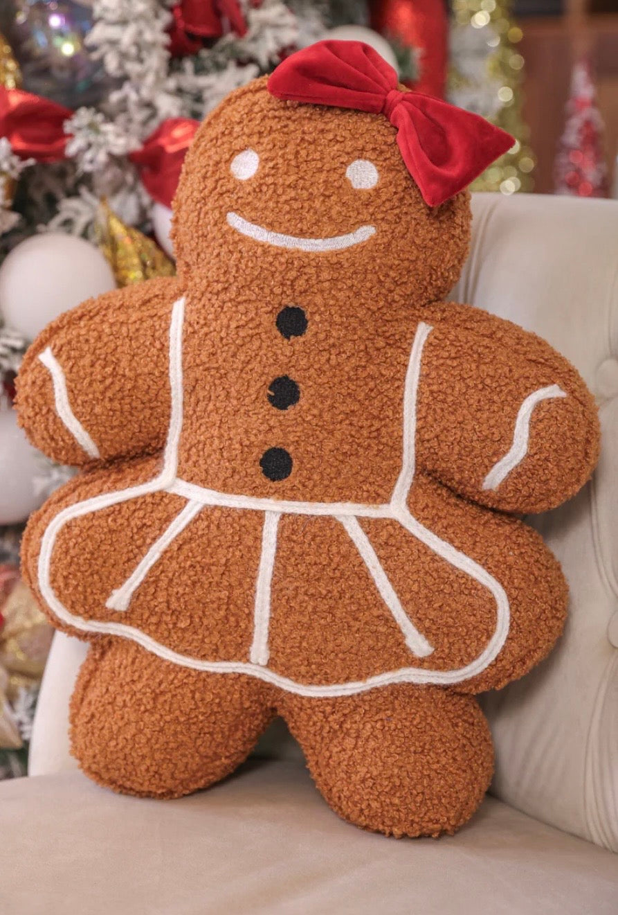 Gingerbread girl pillow with festive details, soft and cozy holiday home accent.