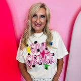 Ivory Comfort Colors tee with hot pink Give Grace lettering, polka dots, and colorful stars