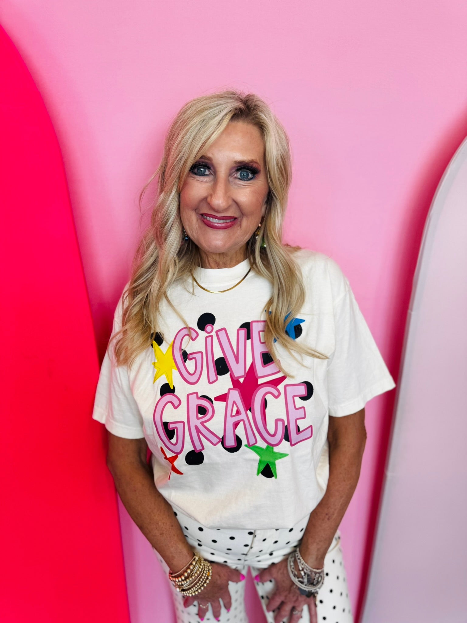 Ivory Comfort Colors tee with hot pink Give Grace lettering, polka dots, and colorful stars
