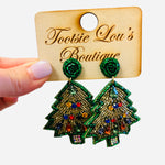 Green beaded Christmas tree earrings with gold accents and colorful gem ornaments, matching beaded stud.