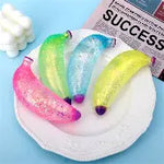 Glitter banana squishy stress toy with sparkling sensory texture.