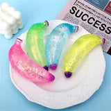 Glitter banana squishy stress toy with sparkling sensory texture.