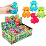 Glitter-filled Highland cow squishy sensory toy in assorted bright colors.