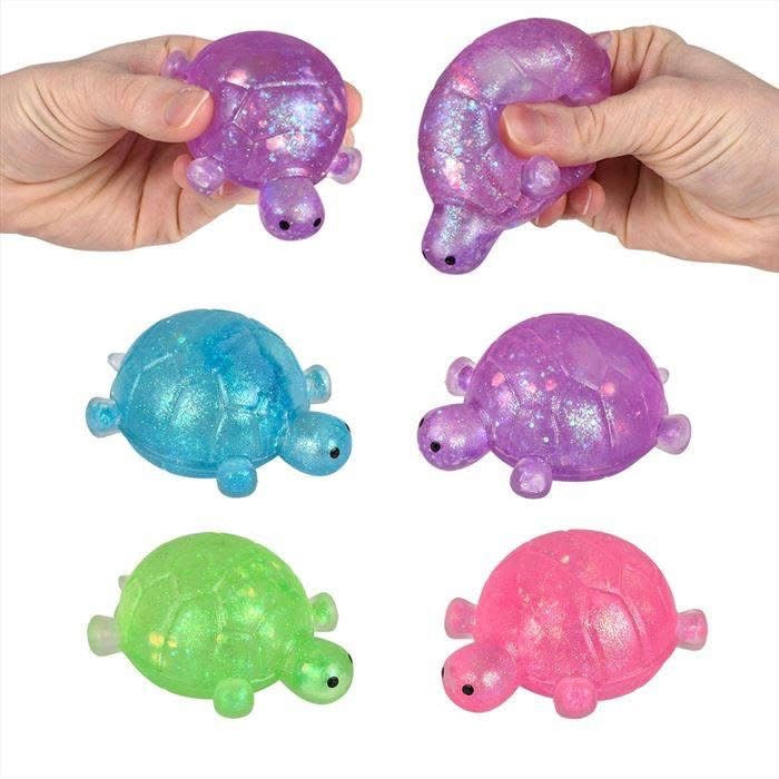 Glitter-filled turtle squishy sensory toy in assorted colors.