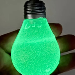 Glow-in-the-dark light bulb shaped squishy sensory fidget toy.