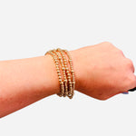 Gold beaded bracelet stack set of four with varying sizes water resistant