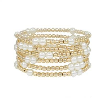 Gold beaded stretch bracelet with pearl accents, water resistant design.