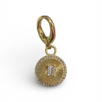 Gold sunburst scarf charm with baguette crystal center and clear stone halo