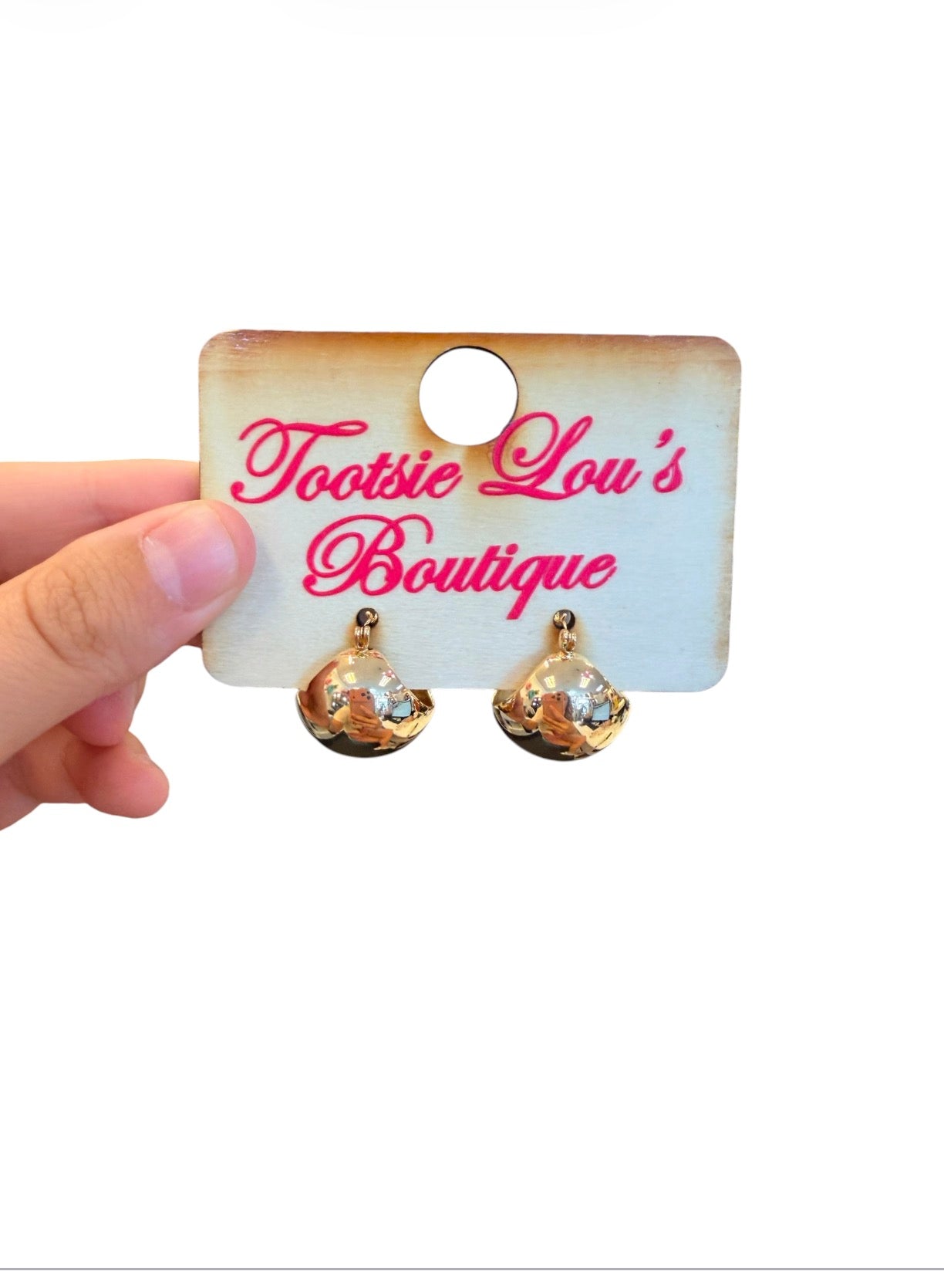 Gold dipped puffy hoop earrings with chunky polished finish.