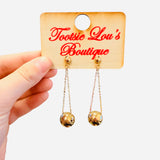 Gold drop earrings with double chains and glossy sphere accents lightweight design