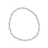 Gold filled and mother of pearl beaded bracelet with delicate stretch design.