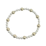 Gold filled and pearl beaded bracelet with mixed sizes and stretch fit.