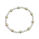 Gold filled and pearl beaded bracelet with mixed sizes and stretch fit.