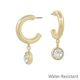 Gold hoop earrings with sparkling circle crystal drop charm, water resistant and lead and cadmium safe.