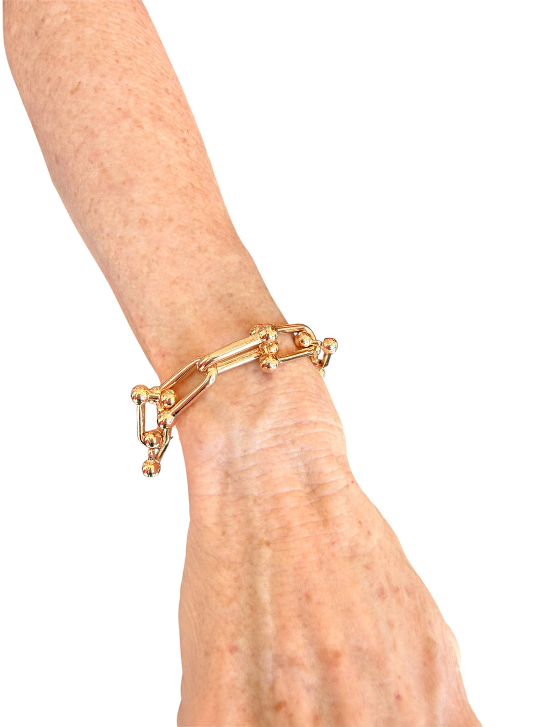 Gold linked bracelet with water-resistant finish, perfect for daily wear and stylish layering.