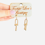 Gold linked earrings with interlocking chain design, water-resistant and lightweight for everyday wear.