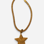 Gold necklace with oversized rhinestone star pendant and crystal-covered chain.