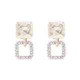 Gold 1" dangle earrings with rhinestone square drop, lead, cadmium, and nickel compliant.