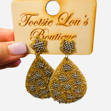 Teardrop earrings with gold and silver beadwork and star-shaped beaded stud.