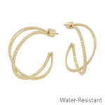 Gold twisted hoop earrings with textured design, 1.25 inch, water resistant.
