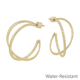 Gold twisted hoop earrings with textured design, 1.25 inch, water resistant.