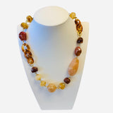 Chunky mixed stone necklace with amber cream and brown tones.
