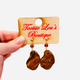 Gold stud earrings with tortoise shell drop