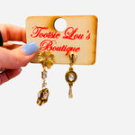 Gold mismatch earrings with crystal drops sunburst stud and teardrop design