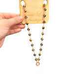 Waterproof metallic beaded necklace with smoky gray and gold beads, gold clasp, and charm-ready design.