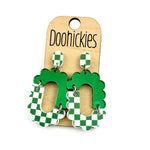 Green checkered acrylic dangle earrings with hypoallergenic stainless steel settings.