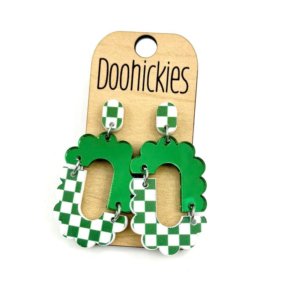 Green checkered acrylic dangle earrings with hypoallergenic stainless steel settings.
