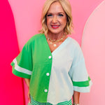 Green colorblock button top with mint panels and wide contrast sleeves.