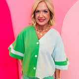 Green colorblock button top with mint panels and wide contrast sleeves.