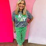 Green Game Day tee with patchwork appliqué lettering and mixed green print details.