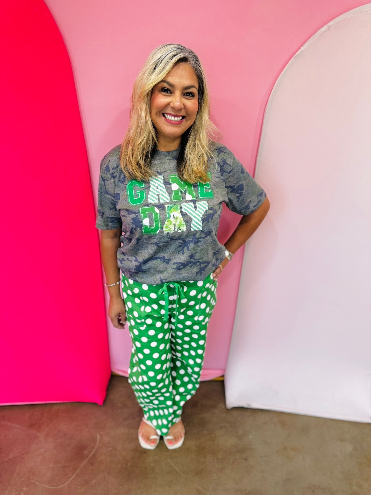 Green Game Day tee with patchwork appliqué lettering and mixed green print details.