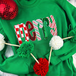 Green sweatshirt with chenille “Merry” patch featuring candy-cane stripes, sequins, and glitter details.